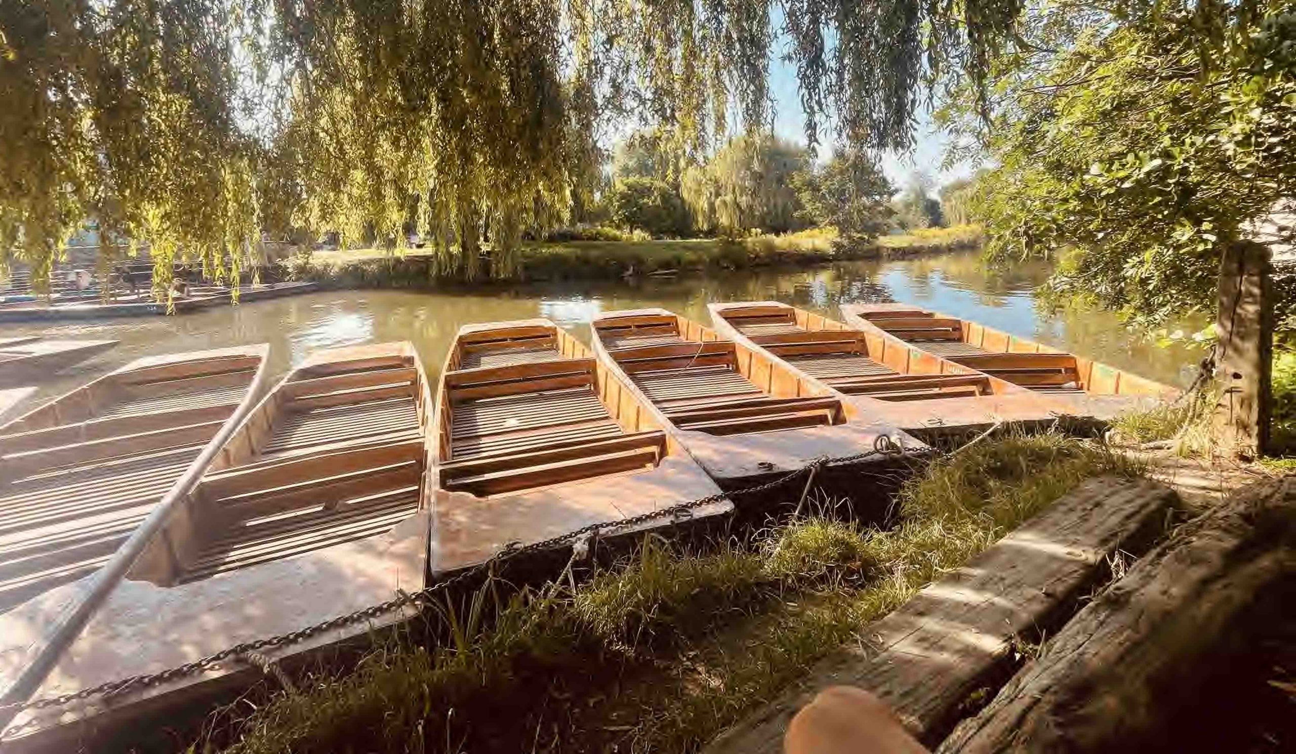 row of empty punts on millpond