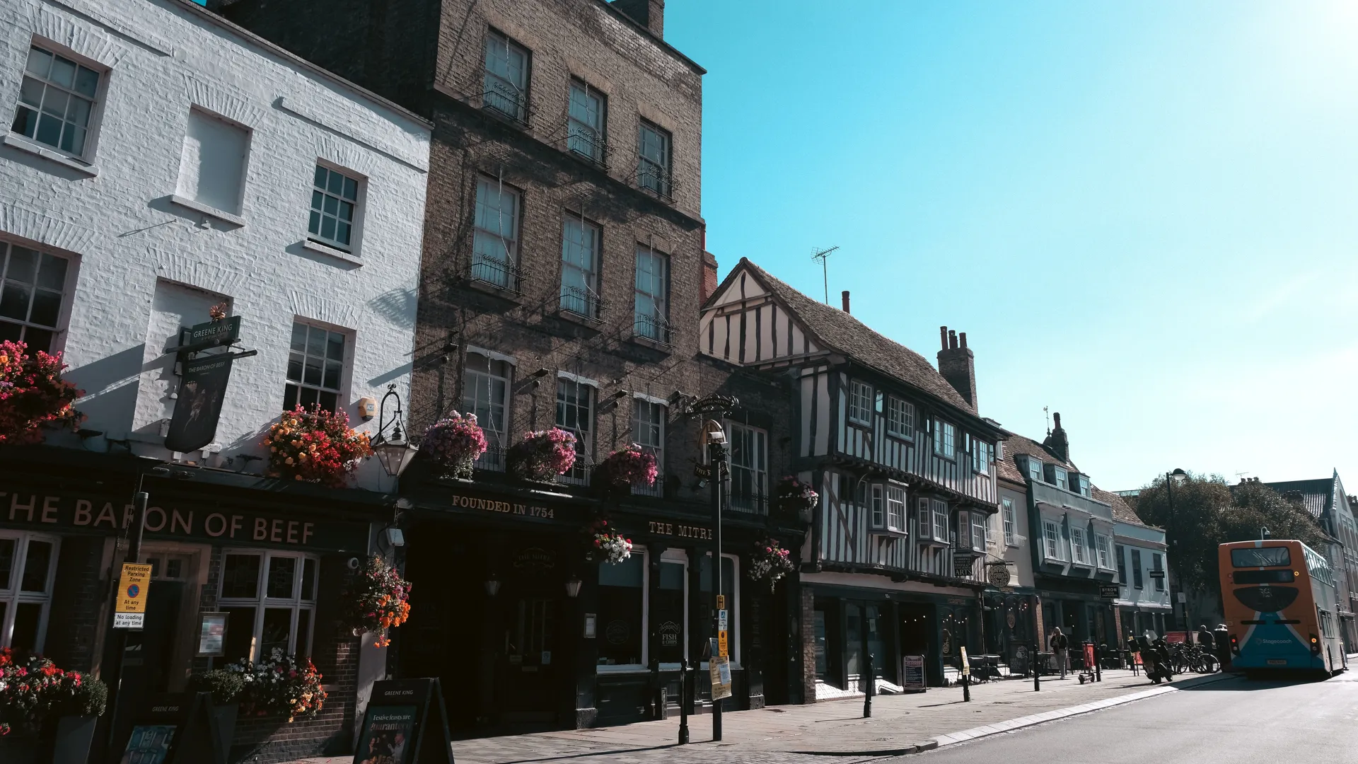 A street in cambridge with a bus